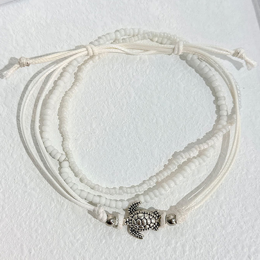 Layered White Beaded Animal Patchwork Anklets